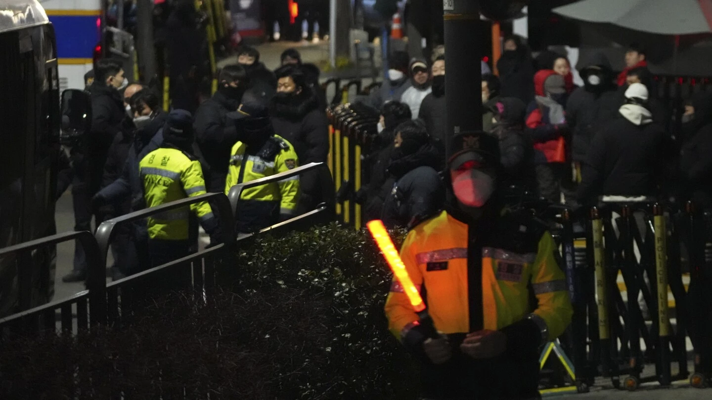 Yoon becomes South Korea's first sitting president to be detained after martial law chaos